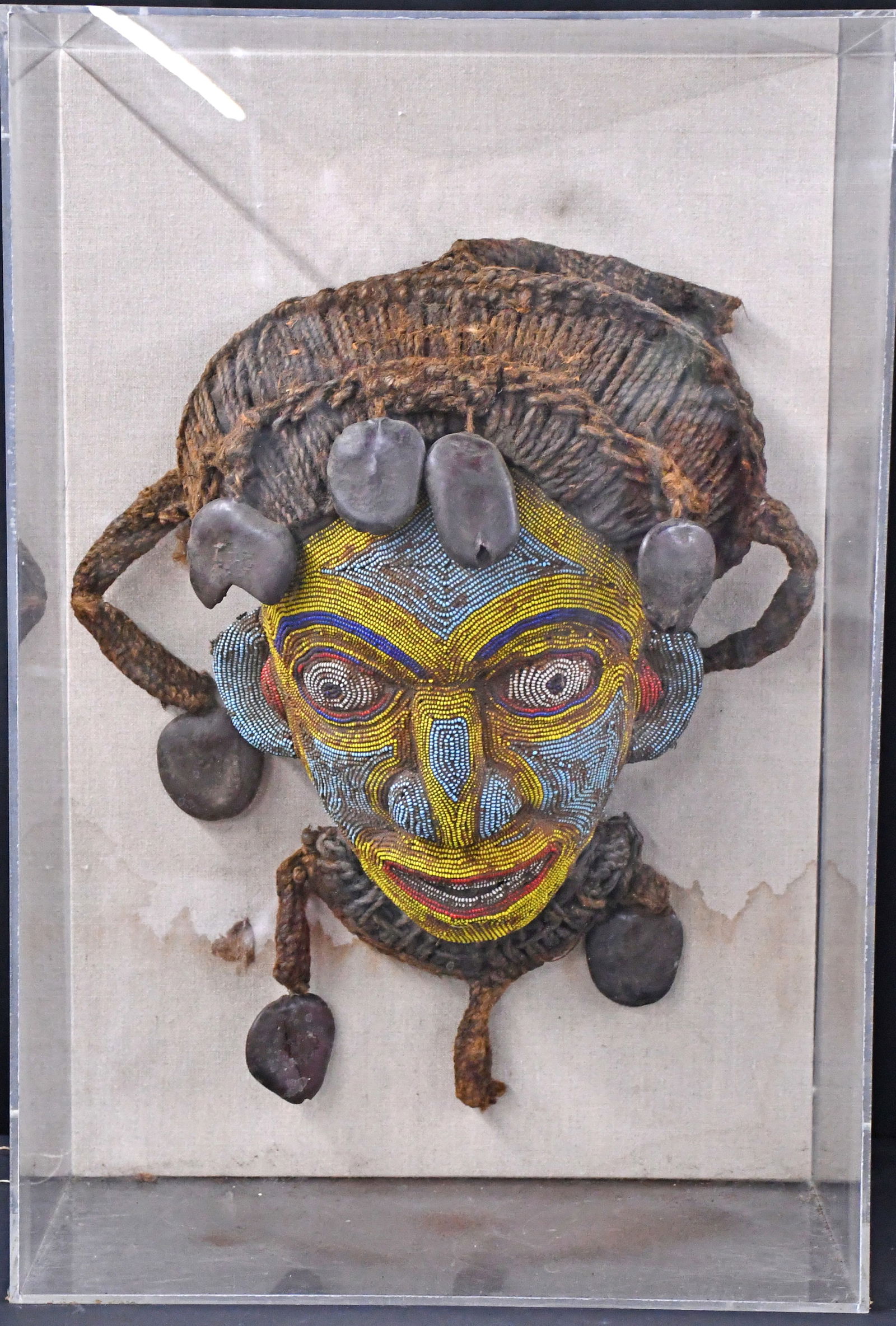 African Mask.: African Mask. Unknown Tribe. Beads, seeds, and yarn backed to wood. Soiled throughout, needs new frame, otherwise good to fair condition. 18" h. Est. $200-300. Ship: $100 Please Read Before You