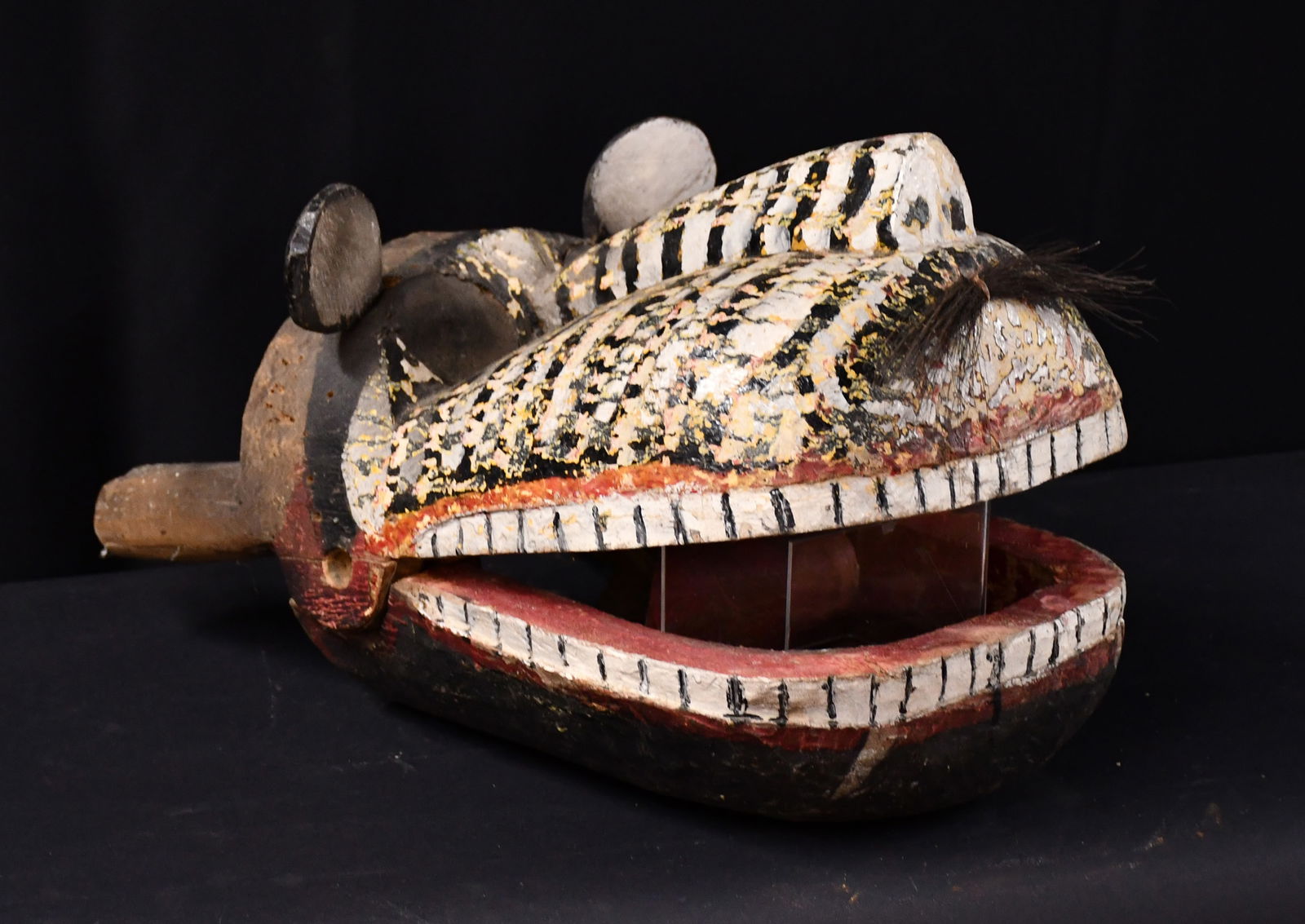 International Jaguar Head Mask.: International Mask. Jaguar Head. Carved and painted wood with mixed media. Good condition. 17" long. Est. $200-300. Ship: $75 Please Read Before You Bid: By registering for and/or placing a bid in