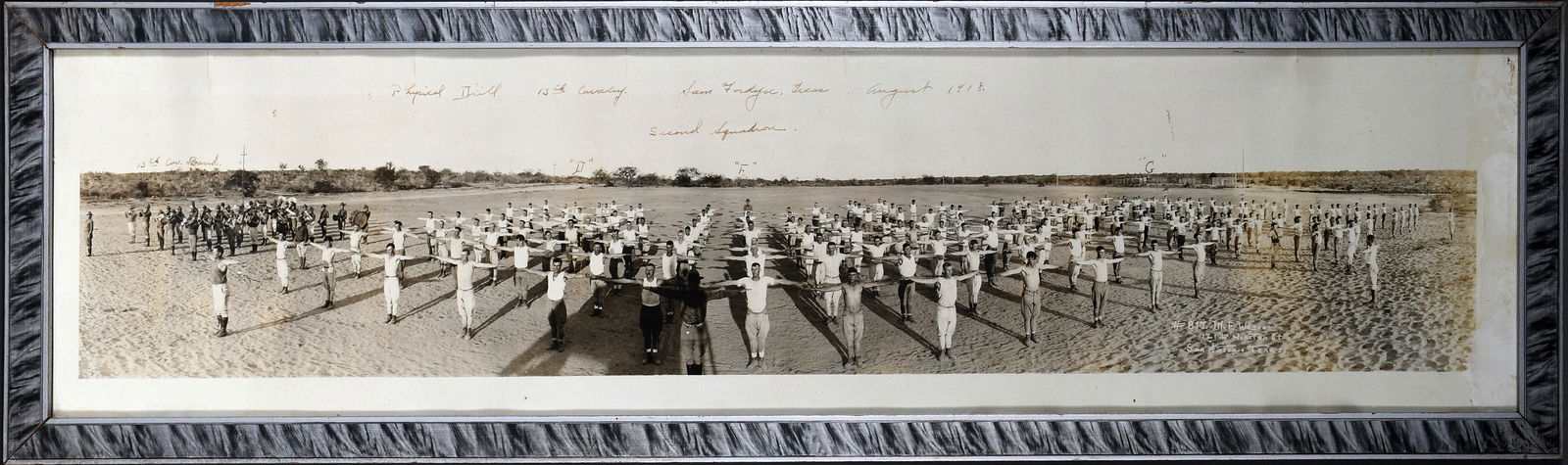 M.F. Weaver. Physical Drill 13th Calvary, TX.: M.F. Weaver. San Antonio TX. Physical Drill 13th Calvary, TX. 1918. Signed, dated and titled. Black and white yard long photograph. Creases from early folding, otherwise good condition. Size with