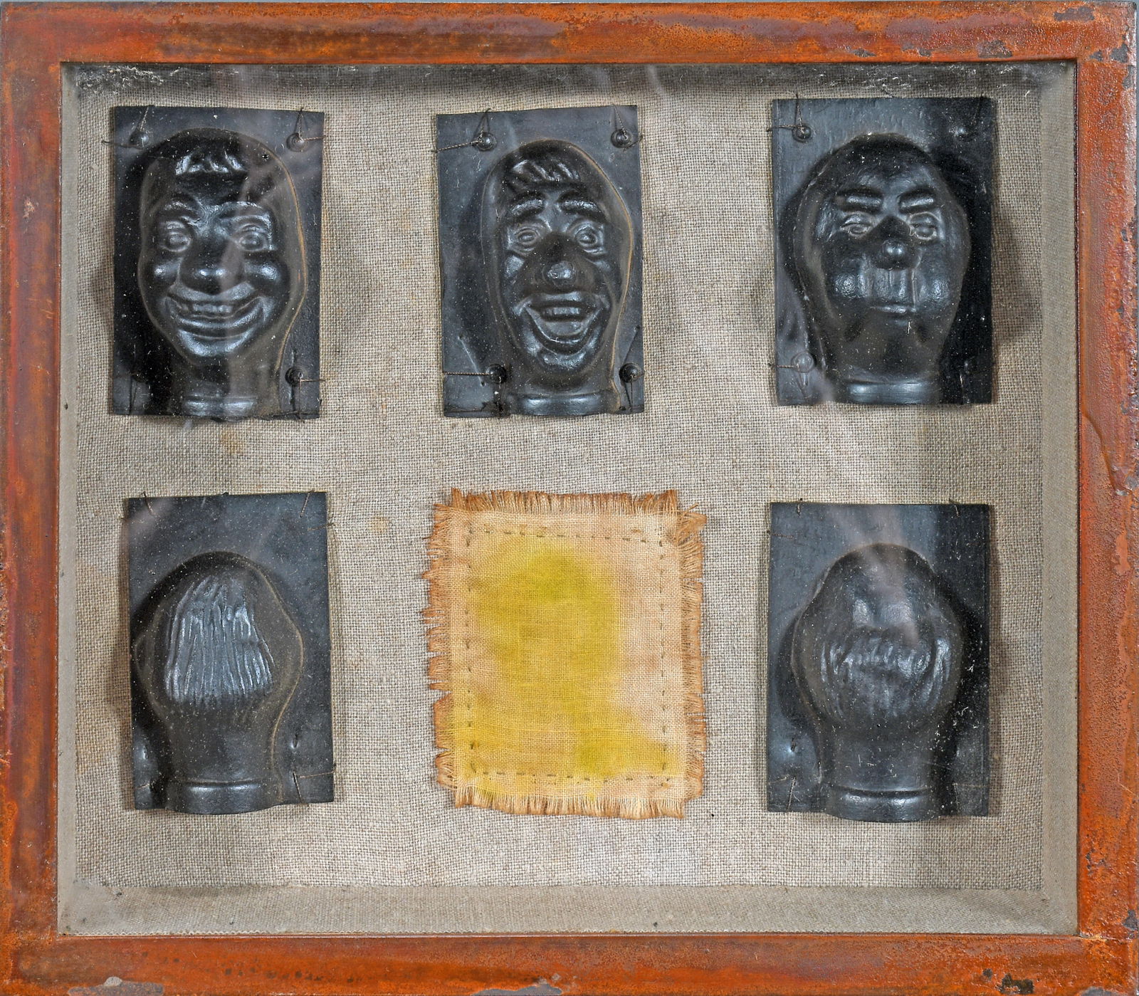 Doll Head Casts with Shadow Box Frame.: Doll Head Casts with Shadow Box Frame. Cast metal in shadow box. Excellent condition. 10.5" w x 9" h. Est. $200-300. Ship: $55 Please Read Before You Bid: By registering for and/or placing a bid