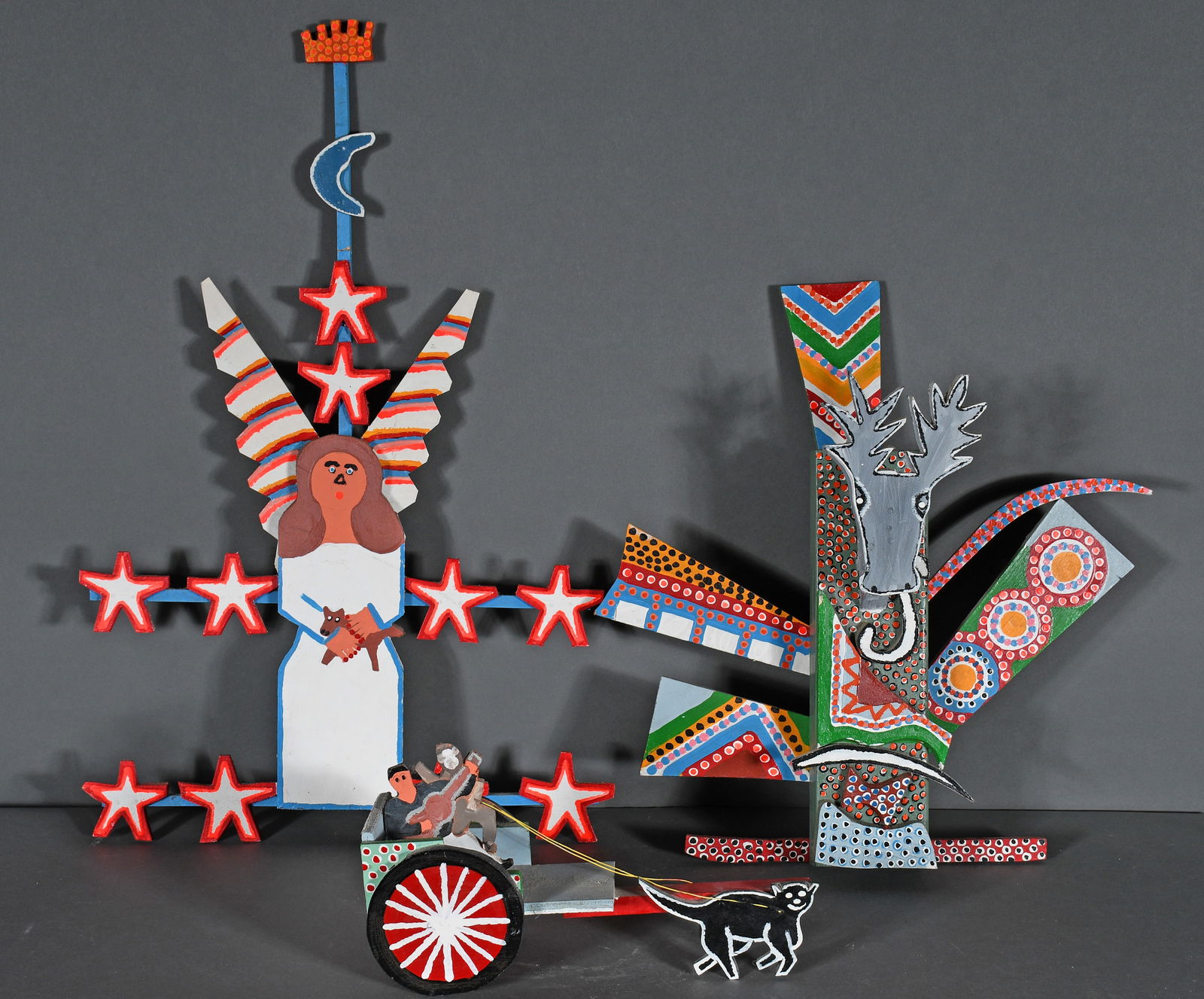 James Harold Jennings. Deer Trophy, Angel & Wagon.: James Harold Jennings. Group of Three. Deer Trophy, Angel and Wagon. Deer is signed. Paint and mixed media constructions. Angel has been broken and repaired at top. Largest is 16.5" w x 26" h. Est.