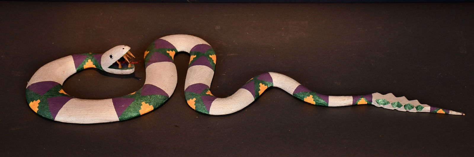 Paul Lutonsky. Southwestern Rattlesnake.: Paul Lutonsky. Southwestern Rattlesnake. 1993. Signed and dated. Carved and painted wood. Excellent condition. 26" long. Est. $200-300. Ship: $85 Please Read Before You Bid: By registering for