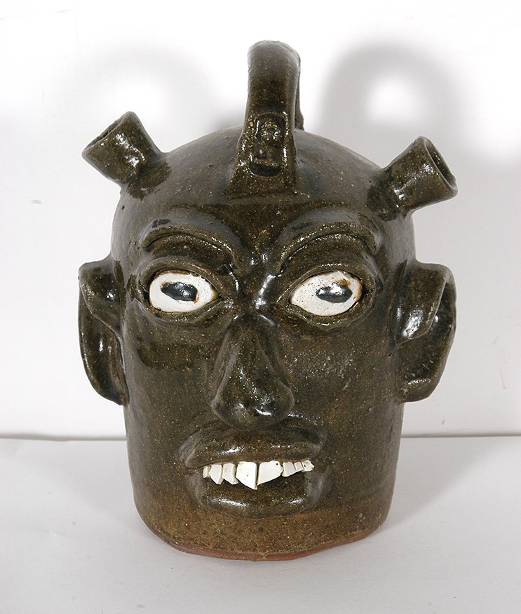 Chester Hewell. Dbl-Spouted Face Jug.: Chester Hewell. Double-Spouted Face Jug.1993. Signed and dated. Mint condition. 11.5”h. Est. $200-300. Ship: $55