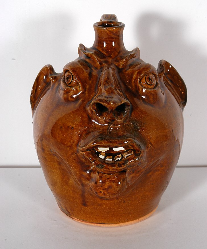 Robert Brown. Face Jug.: Robert Brown Eureka, MT. Face Jug. 1990. Signed and dated. New Eureka glaze. Mint condition. 9.5” h. Est. $100-200. Ship: $45