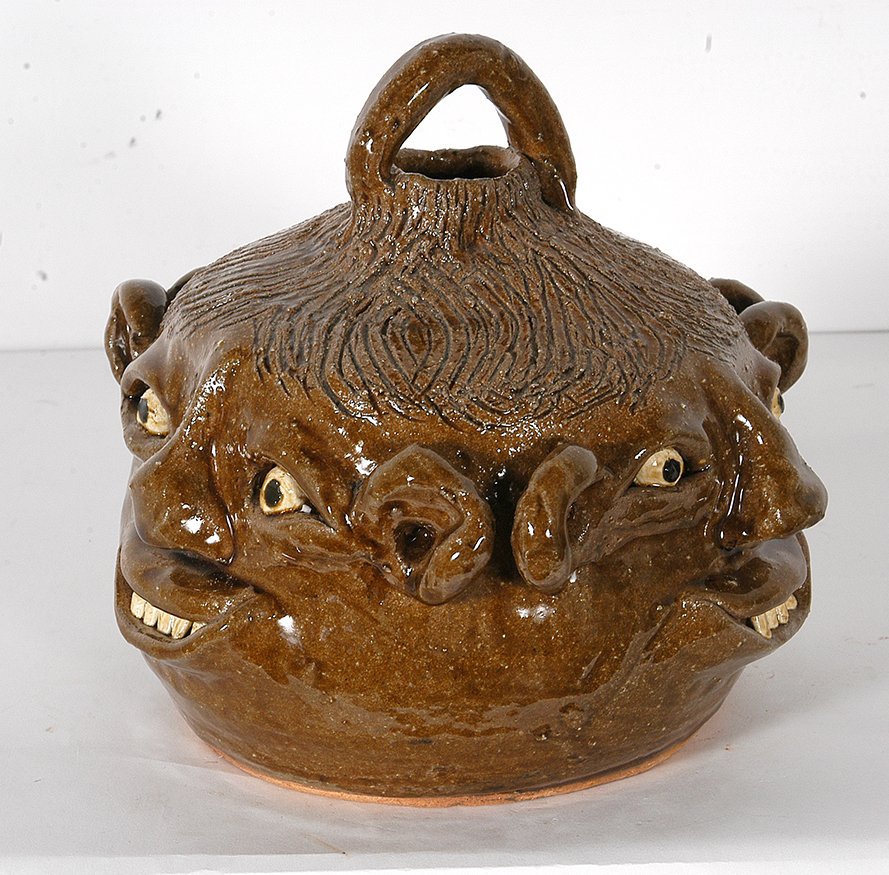 Reggie & Flossie Meaders. Triple Buggy Face.: Reggie and Flossie Meaders. Triple Buggy Face Jug. Signed. Mint condition. 8.5” h. Est. $500-800. Ship: $55