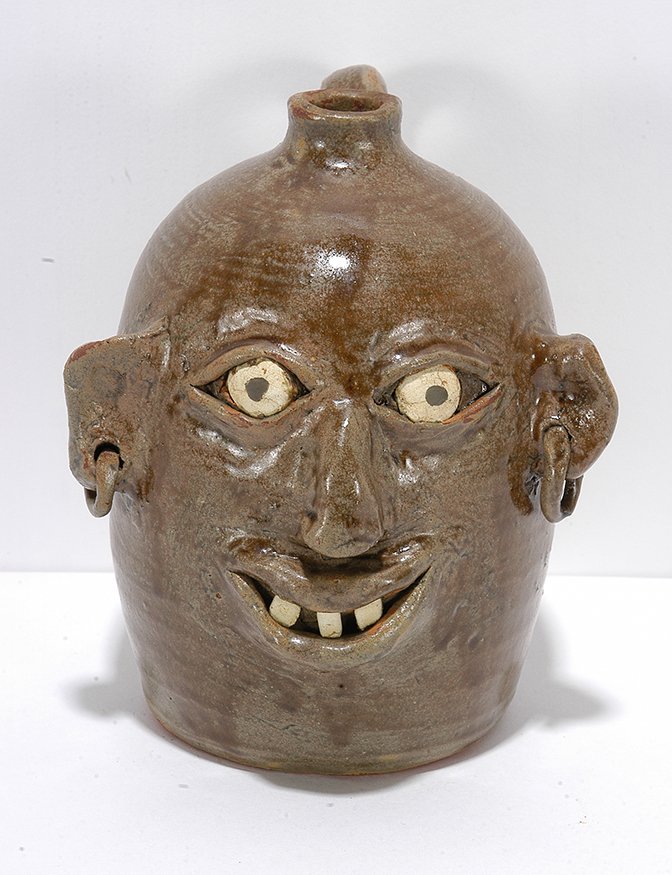 Flossie Meaders. Face Jug w Earrings.: Flossie Meaders. Face Jug With Earrings. Signed and dated with 100 year anniversary date. Mint condition. 7.5” h. Est. $300-500. Ship: $45