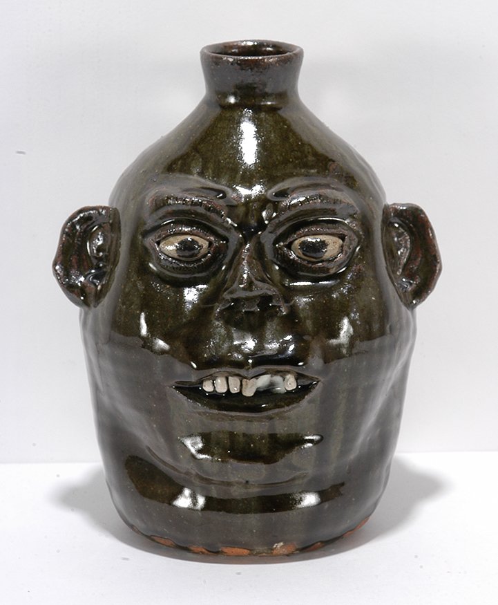 Cleater Meaders. Face Jug.: Cleater Meaders. Face Jug. 1989. Signed and dated. Deep rich dark green glaze. Mint condition. 9.5”h. Est. $200-400. Ship: $45