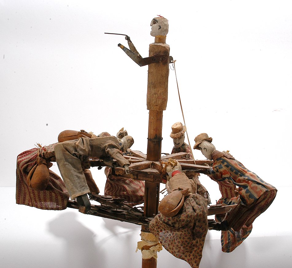 Anonymous Amish. Spirit Chaser.: Anonymous Amish. Spirit Chaser. Rare noise maker used in celebration in Amish life. Carved figures with noise clappers, homemade clothing, tin and wire on a an umbrella frame. Some loss, otherwise gre