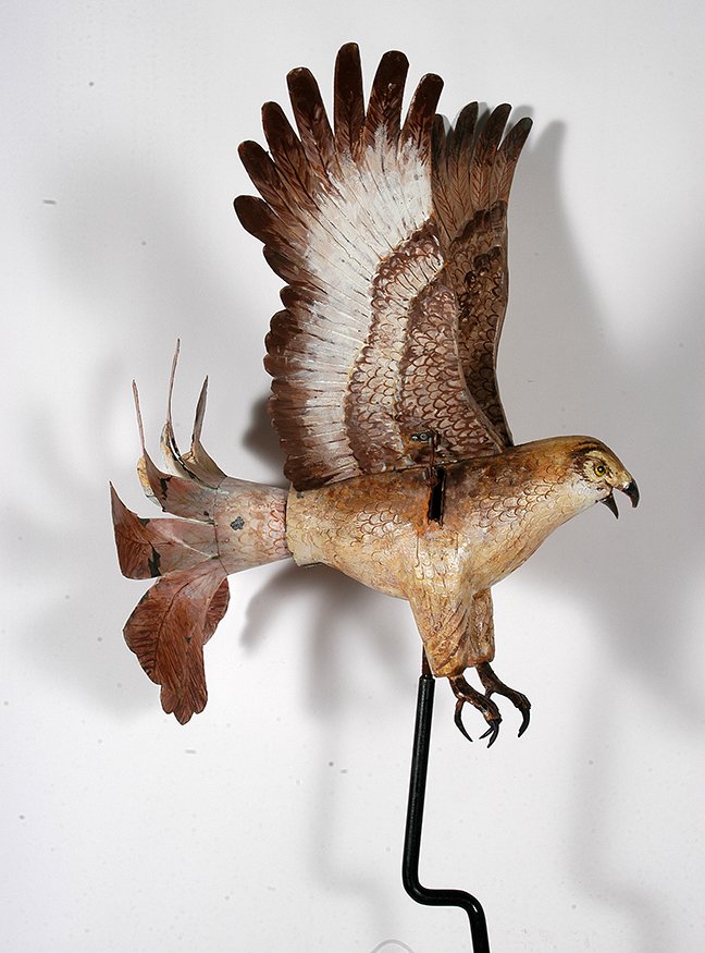 Ralph Boutilier. Hawk Whirligig.: Ralph Boutilier. Hawk Whirligig. c. 1988. Signed. Carved and painted wood with articulated gear moves wings and beak up and down as tail rotates. Minor paint loss on tail, otherwise excellent conditio