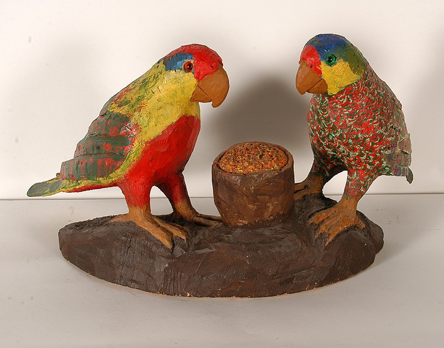 Pucho Odio. Parakeets.: Pucho Odio. Parakeets. Signed. Not dated. Carved and painted wood. Missing part of tail feathers, otherwise good condition. 20”long x 10.5” h x 10” w. Est. $200-300. Ship: $65