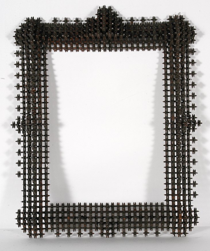 Lg Crown Of Thorn Frame w Pyramids.: Tramp Art Large Crown Of Thorn Frame With Pyramids On Top. Carved and stained wood. Some missing pieces, otherwise great condition. 24” x 28” x 4”. Est. $600-900. Buyer is responsible for shippi