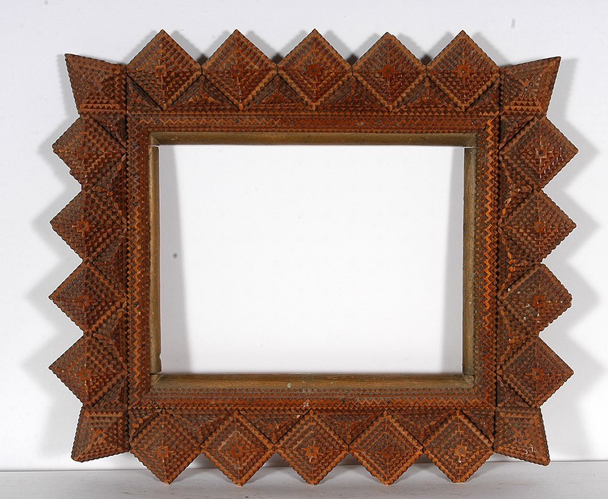 Decorative Tramp Frame: Tramp Art Decorative Tramp Frame. Carved wood. Minor chips, otherwise great condition. 20” x 17” x 1.5”. Private collection. Est. $200-300. Ship: $45