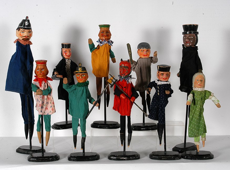 10 Puppets.: Anonymous Group Of 10 Puppets. c. 1930’s. Carved heads with paint and handmade cloth costumes. Great condition. Average height is 16”h. Est. $800-1,200. Ship: $55