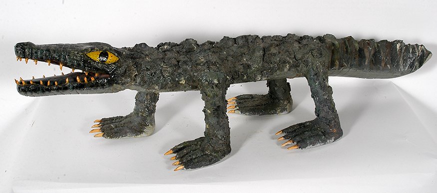 Isaac Smith. Alligator.: Isaac Smith. Alligator. Signed. Carved wood with mixed media and paint. Excellent condition. 13” x 14”x 46”long. Est. $300-500. Ship: $200