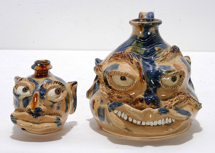Billy Ray Hussey. Father & Son Buggy Face Jugs, XIX.: Billy Ray Hussey. Father & Son Buggy Face Jugs, XIX. Initialed. Multi-colored glazed pottery pieces. Mint condition. Tallest is 5”h. Est. $200-400. Ship: $55