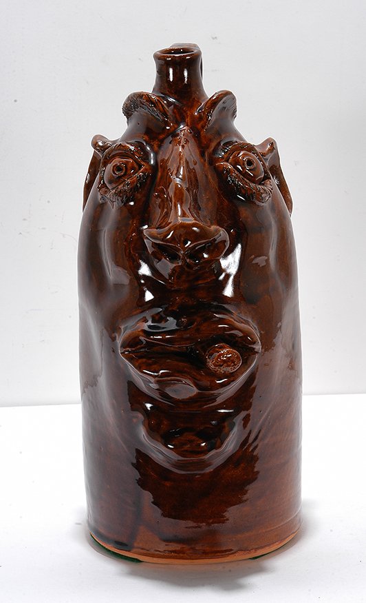 Robert Brown. Large Face Jug With Cigar.: Robert Brown. Large Face Jug With Cigar. 1986. Signed and dated. Traditional glaze. Mint condition. 14.5”h. Est. $200-400. Ship: $65