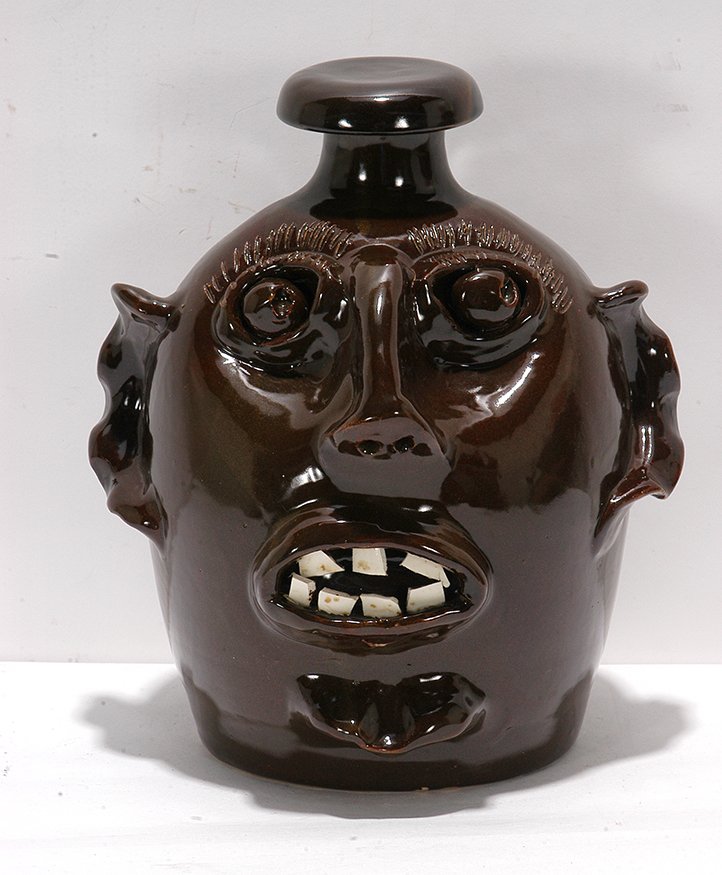 W.J. Gordy. Face Jug With Stopper.