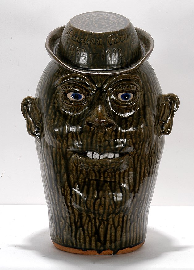 Cleater & Billie Meaders. 5 Gallon Face Jug.: Cleater & Billie Meaders. Five Gallon Face Jug. Celebrating 100 Years Of Meaders Pottery. 1992. Signed and dated. Script on back. Mint condition. 20”h. Est. $800-1,200. Ship: $150