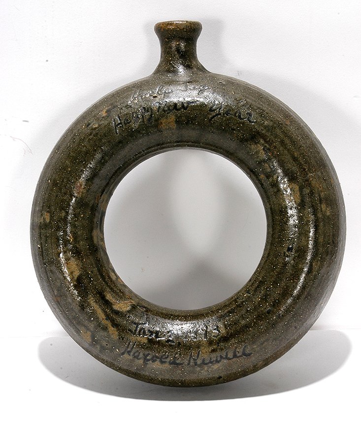 Harold Hewell. Happy New Year Hoop Jug.: Harold Hewell. Happy New Year Hoop Jug. 1993. Signed, dated and titled. Large ring jug with tobacco-spit glaze. Drip on backside knocked off, otherwise great condition. 11”h. Est. $200-300. Ship: $4