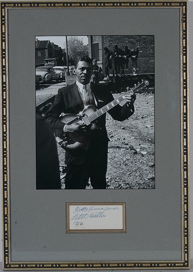 Little Walter. Photo With Signature Card, 1964.: Little Walter (1930-1968). Photo With Signature Card. Photo is signed by photographer and dated, 1963. Signature card is signed, “To My Friend from Little Walter, 1964.” Minor water stain on card,
