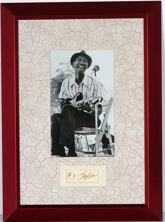 Hound Dog Taylor. Photo With Signature Card.: Hound Dog Taylor (1915-1975). Photo With Signature Card. Signature in red ink on paper. Theodore Roosevelt Hound Dog Taylor American Blues Guitarist with extra finger on his hand. Photo is 4.5”w x 8