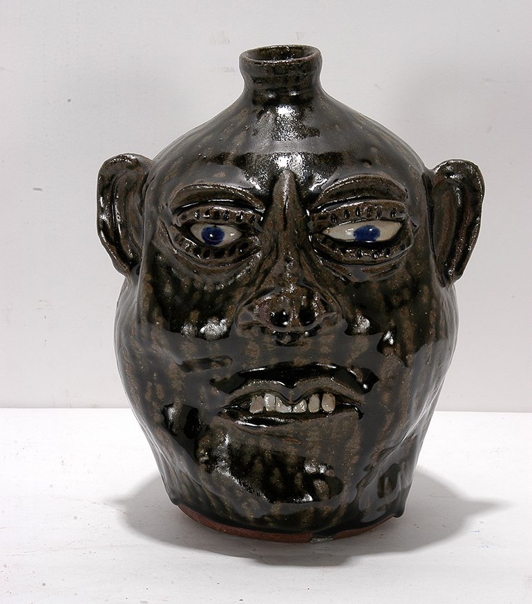 Cleater Meaders. Deep Tobacco Spit Glaze Face Jug.: Cleater Meaders. Deep Rich Tobacco Spit Glaze Face Jug.1988. Signed and dated. Mint condition. 9”h. Est. $300-400. Ship: $45