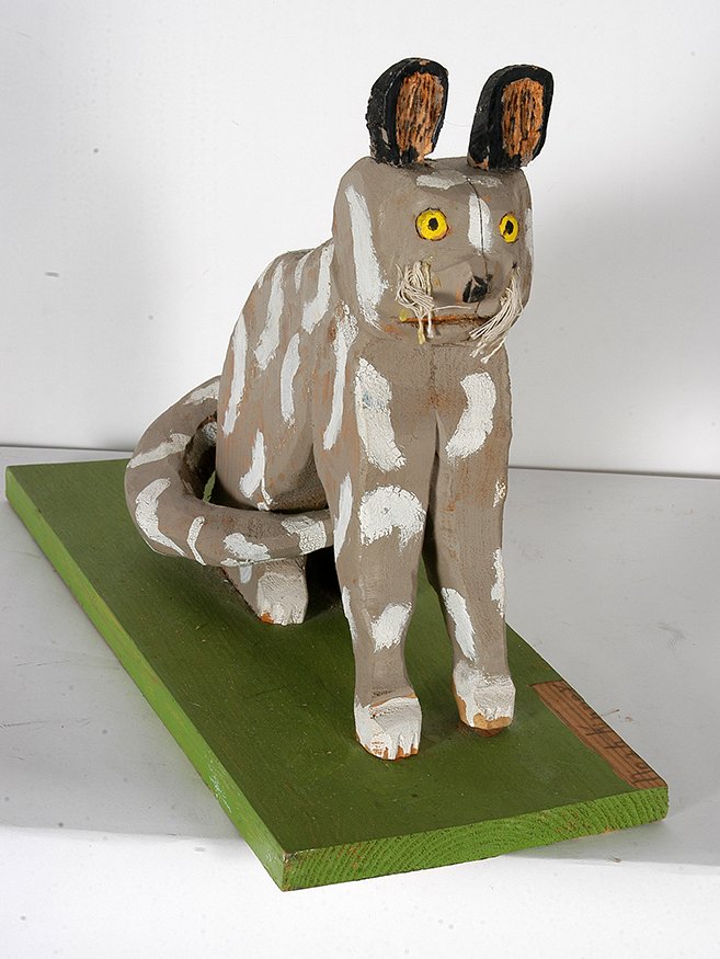 Noah Kinney. Spotted Cat.: Noah Kinney. Spotted Cat.Signed. Not dated. Carved and painted wood with string whiskers. Excellent condition. 18”x 13” x 7”. Est. $1,000-1,500. Ship: $65