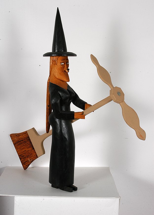 Sulton Rogers. Witch Whirligig.: Sulton Rogers. Witch Whirligig.Not signed or dated. Carved and painted wood. Excellent condition. 32”h x 32”. Masterpiece. Est. $1,000-2,000. Ship: $125