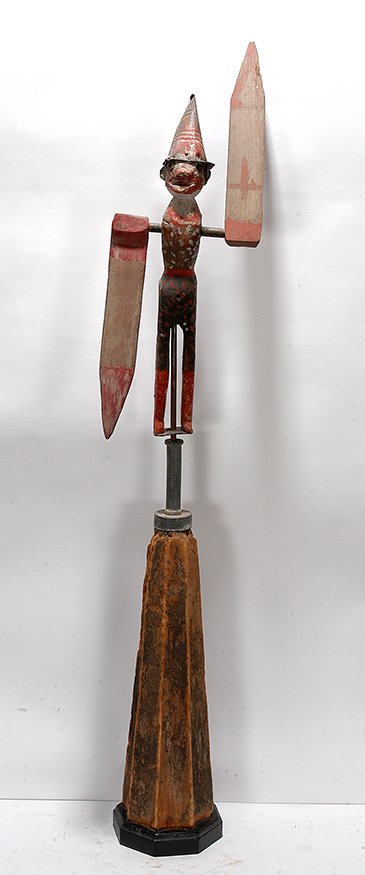 Clown Whirligig.: Anonymous. Clown Whirligig. c. 1930. Conneaut, Ohio. Painted wood with tin hat. Object is 23” h. 45”h including stand. Very cood condition. Exhibited as part of the Linda and Gene Kangas Collectio
