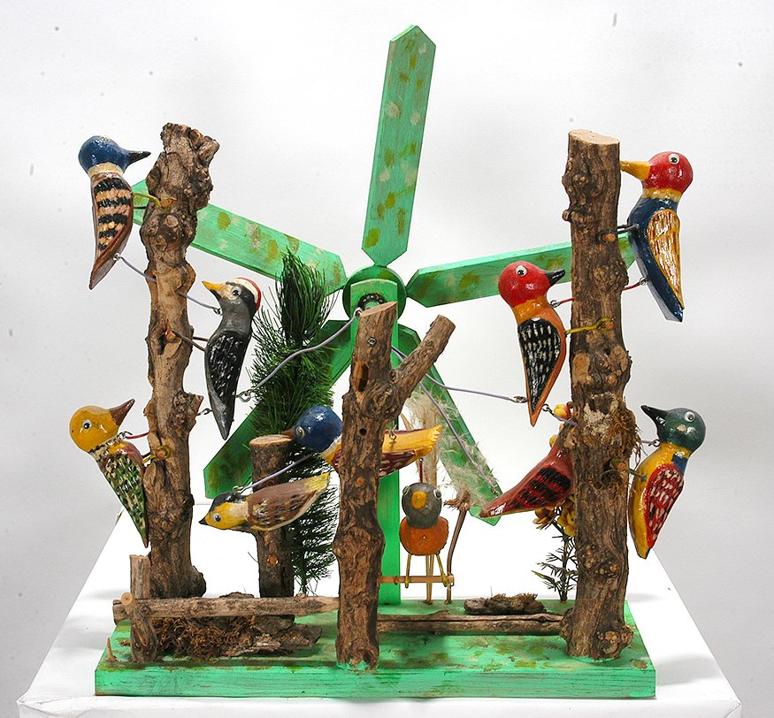 John Bambic. Woodpecker Whirligig.: John Bambic. Woodpecker Whirligig. 2000. Signed. Carved and painted wood with mixed media. One limb is broken, otherwise great condition. 17” x 14” x 6”. Est. $300-500. Ship: $65