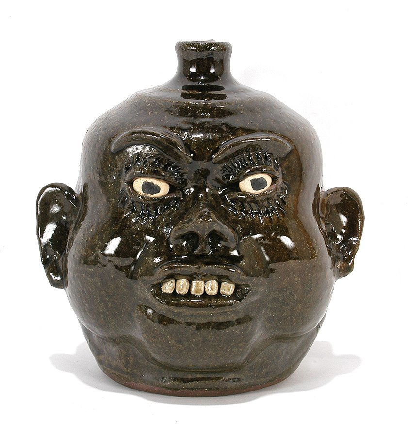 Lanier Meaders. Chubby Cheek Face Jug.: Lanier Meaders. Chubby Cheek Face Jug. c. late 1970's. Signed. Clay teeth. Mint condition. 9". Est. $1,000-1,500. Ship: $55