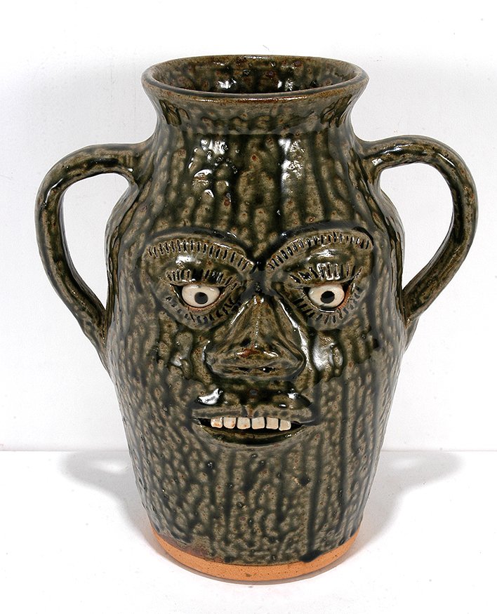 A.G. Meaders. Double Face Pitcher.: A.G. Meaders. Double Face Pitcher. Signed. Beautiful light green glaze. Mint condition. 10.5". Est. $300-500. Ship: $55