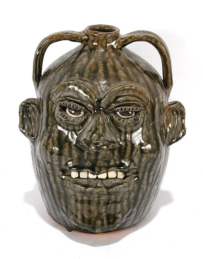 Cleater & Billie Meaders. Large 3 Gallon Face Jug.: Cleater & Billie Meaders. Large Three Gallon Face Jug. 1995. Signed and dated. Beautiful drip glaze. Mint condition. 12". Est. $300-500. Ship: $65