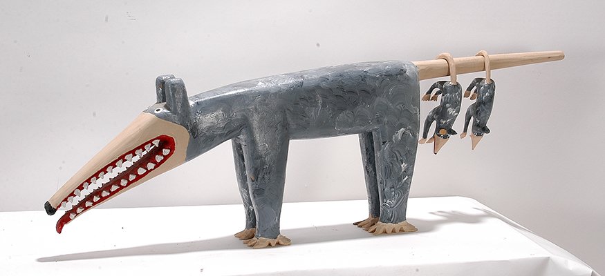 Minnie & Garland Adkins. Opossum With Babies.: Minnie and Garland Adkins. Opossum With Babies. 1997. Signed and dated. Carved and painted wood. Chip on mom's foot and chip on baby's ear, otherwise good condition. 12" x 37" x 4". Est. $1,000-2,000.