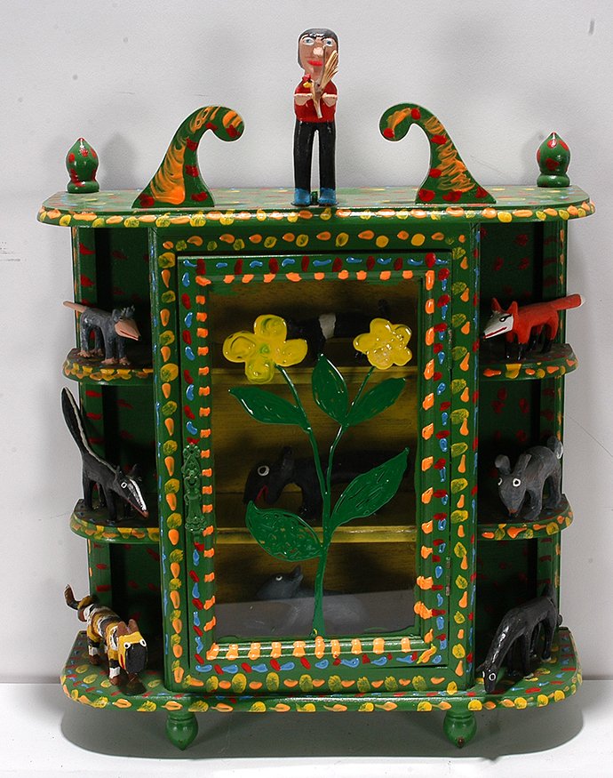 Minnie & Garland Adkins. Medicine Cabinet of: Minnie and Garland Adkins. Medicine Cabinet Full Of Animals. 1996. Signed and dated. Carved and painted wood. Animals attached to old medicine cabinet. Great condition. 14x 5x 19". Est. $200-400. Ship