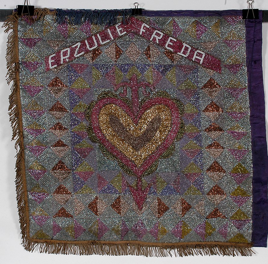 Haitian. Erzulie Freda.: Haitian. Erzulie Freda (Voodoo Goddess Of Love). Hand sewn sequence and beads backed to nylon and burlap. Great condition. 30” x 30”. Est. $200-400. Ship: $35