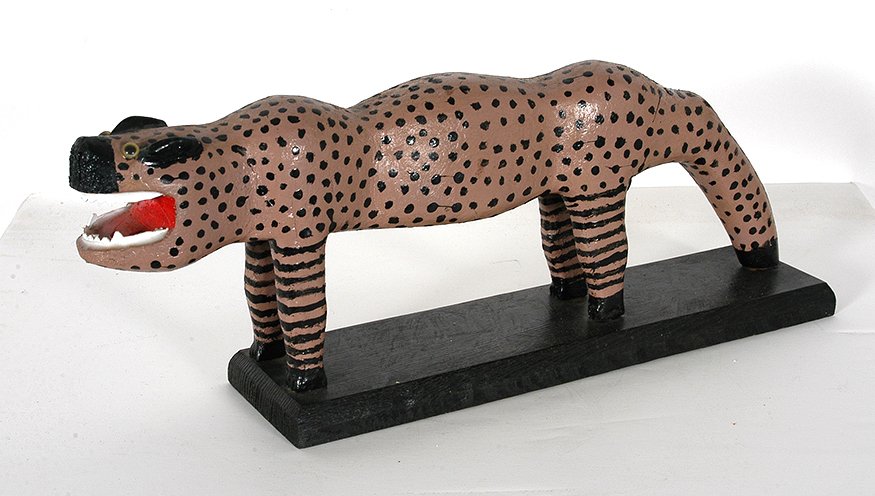 Denzil Goodpaster. Hell Cat.: Denzil Goodpaster. Hell Cat. Signed. Not dated. Carved and painted wood with plastic teeth and jeweled eyes. Excellent condition. 6” x 13” x 3”. Est. $300-500. Ship: $45