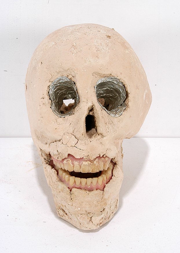 James Son Ford Thomas. Skull w Dentures.: James Son Ford Thomas. Skull With Full Set Of Dentures. Not signed. Gumbo clay with dentures and tin foil. Loss of clay around mouth, otherwise good condition. 7.5”h. Est. $400-600. Ship: $55
