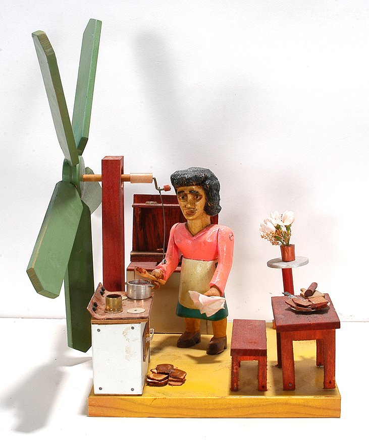 John Bambic. Woman In The Kitchen: John Bambic. Woman In The Kitchen. Signed. Carved and painted wood with mixed media. Excellent condition. 15” x 9” x 9”. Est. $300-500. Ship: $65