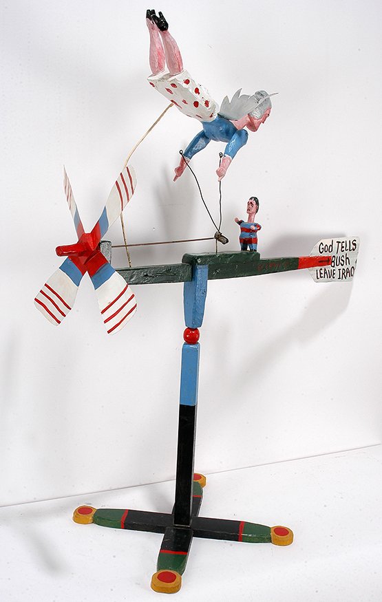 Ed Larson. God Tells Bush Leave Iraq.: Ed Larson. God Tells Bush Leave Iraq. 2005. Signed, dated and titled. Carved and painted wood with mechanical parts. Great condition. 36”x 45”x 20”. Est. $200-400. Ship: $150