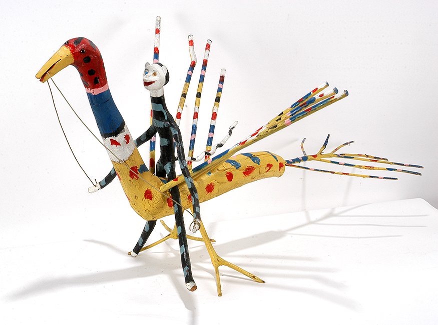 Edd Lambdin. Monkey Riding The Peacock.: Edd Lambdin. Monkey Riding The Peacock. Signed. Carved and painted found twigs and wood. Great condition. 21”x 27” x 44”. Est. $100-200. Buyer is responsible for shipping.