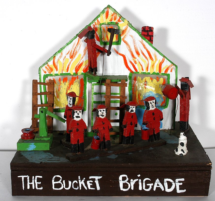Earl Stoutenburg. The Bucket Brigade.: Earl Stoutenburg. The Bucket Brigade. 1984. Dated. Not signed. Carved and painted wooden kinetic diorama. Minor damage on figure, otherwise great condition. 18” x 12”x 16”. Est. $200-400. Ship: