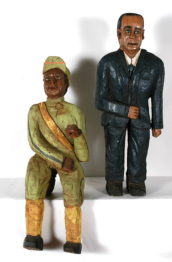 Two Carved Men.: Anonymous. Two Men. c. 1970’s. Not signed or dated. Chainsaw carved and painted with natural wood splits, otherwise good condition. Tallest 38”h. Est. $100-200. Ship: $150