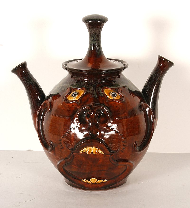 Roger Corn. Double Spouted Face Teapot.: Roger Corn. Double Spouted Face Teapot.2005. Signed and dated. 12”h. Mint condition. Est. $100-200. Ship: $65
