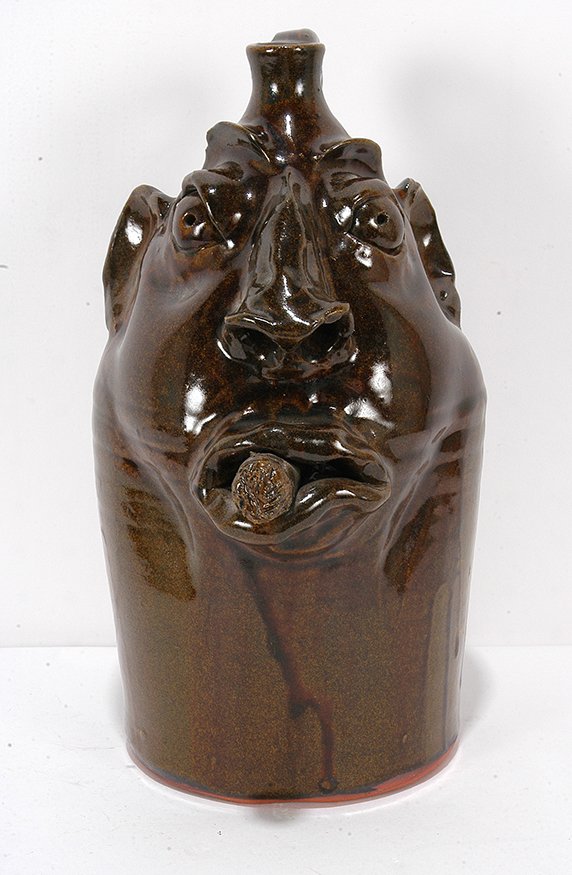 Robert Brown. Face Jug With Cigar.: Robert Brown. Face Jug With Cigar.Signed. Not dated. Mint condition. 12.5”h. Est. $200-300. Ship: $65
