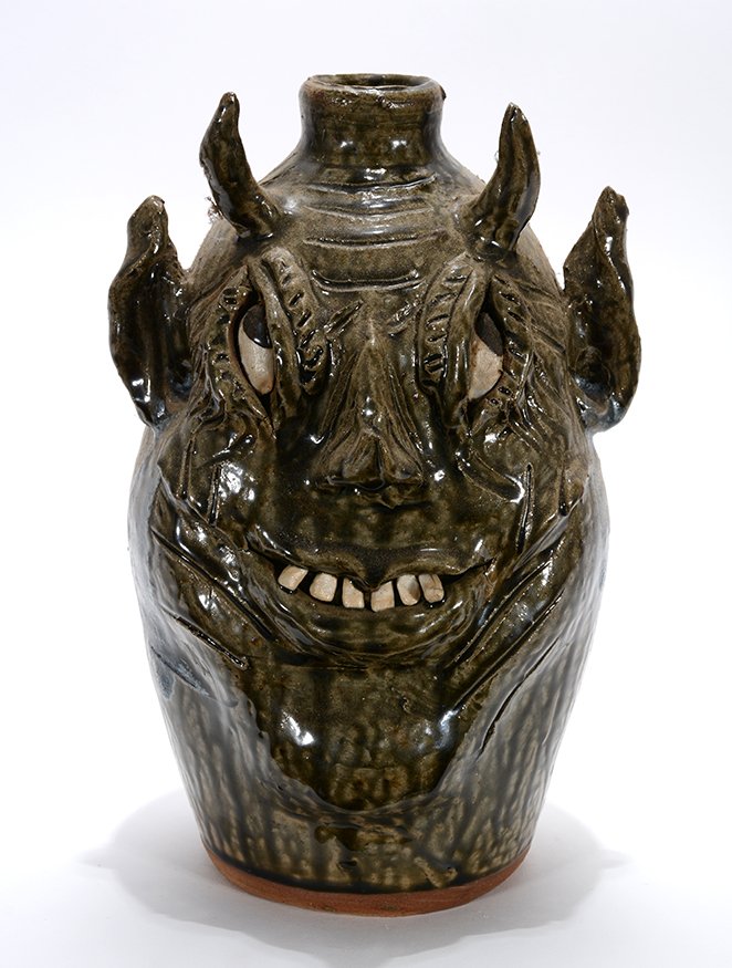 Cleater & Billie Meaders. Devil Face Jug Looking Up.: Cleater & Billie Meaders. Devil Face Jug Looking Up.1995. Signed and dated. Glass drips over tobacco-spit glaze. Mint condition. 11.5”h. Est. $200-400. Ship: $55