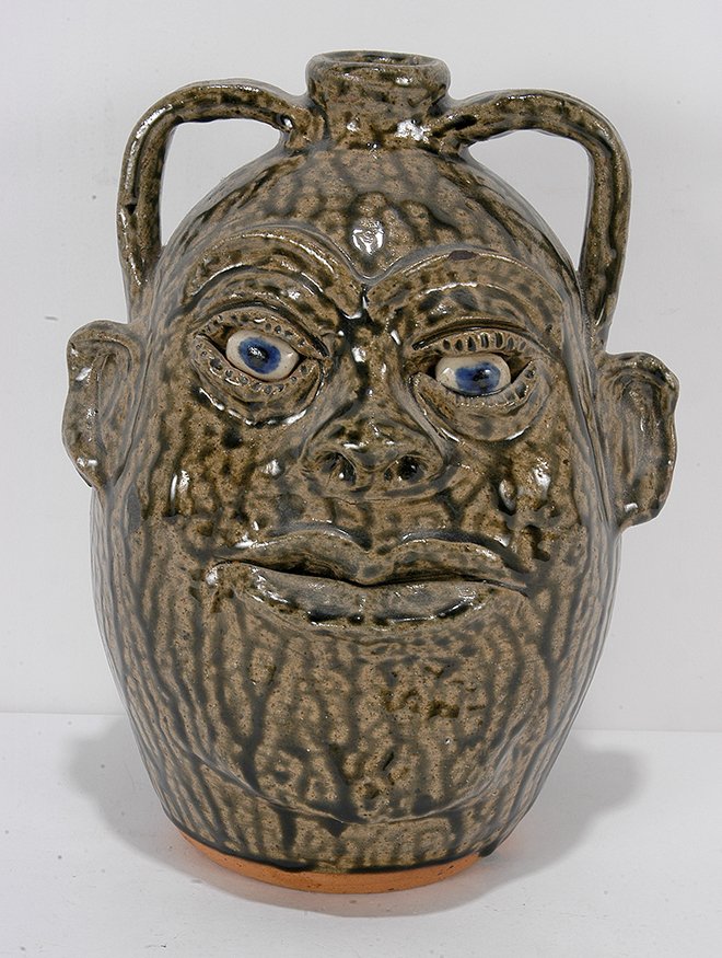 Cleater & Billie Meaders. Double Handle Face Jug.: Cleater & Billie Meaders. Double Handle Face Jug.1996. Signed and dated. Tobacco-spit glaze. Mint condition. 10” h. Est. $200-400. Ship: $45