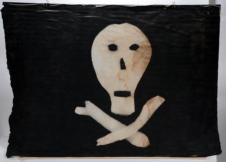 Skull Flag.: Skull Flag.c. 20th century. Paint on cloth. Stain on right side, otherwise good condition. 53” w x 36”h. Est. $300-500. Ship: $55