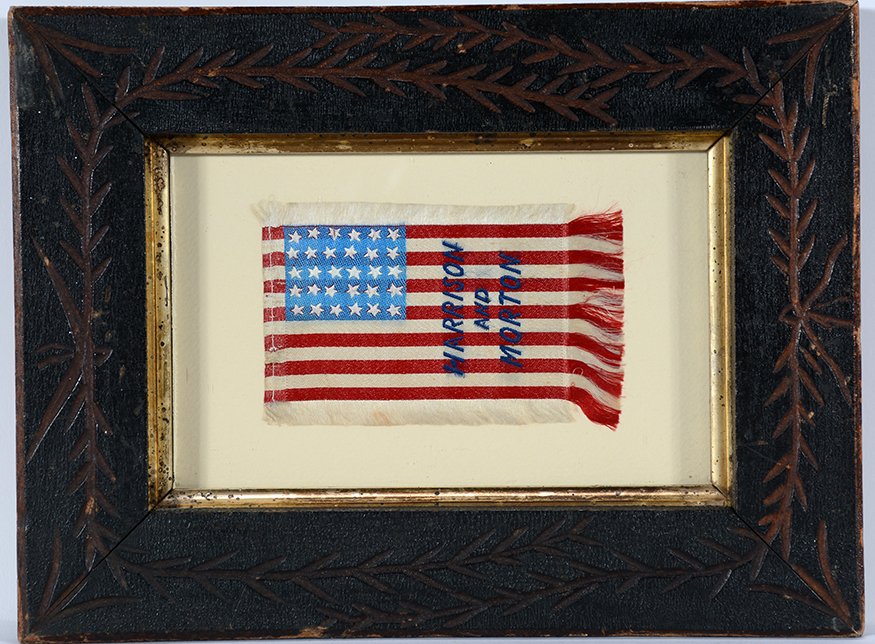 Harrison and Morton Mini Campaign Flag.: Harrison and Morton Mini Campaign Flag. 1888 Republican candidates, Benjamin Harrison and Levi Morton. Sewn over colored silk. Excellent condition. Image is 4.25” w x 3” h. Frame is 9.5” w x 7��
