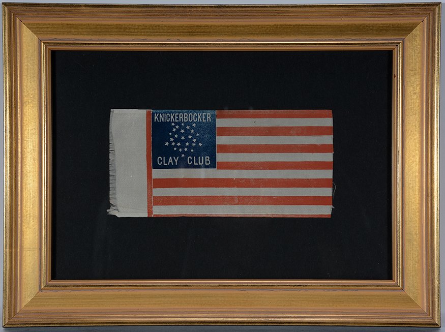 Mini Knickerbocker Clay Club Flag.: Mini Knickerbocker Clay Club Flag. Print on cloth. Great condition. Image is 6” w x 3”. Frame is 11” w x 8.5”h. Est. $300-500. Ship: $35